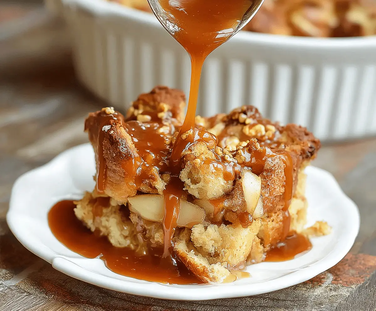 Delicious caramel apple bread pudding topped with caramel sauce and fresh apple slices, perfect for fall dessert lovers.