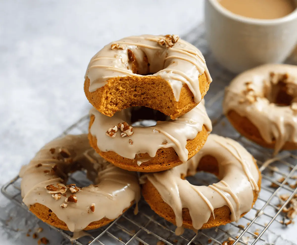 Delicious pumpkin baked donuts topped with a sweet maple glaze, perfect for fall treats and holiday breakfast recipes.