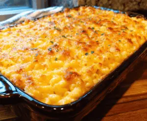 Delicious baked mac and cheese with golden crispy top served in a white bowl