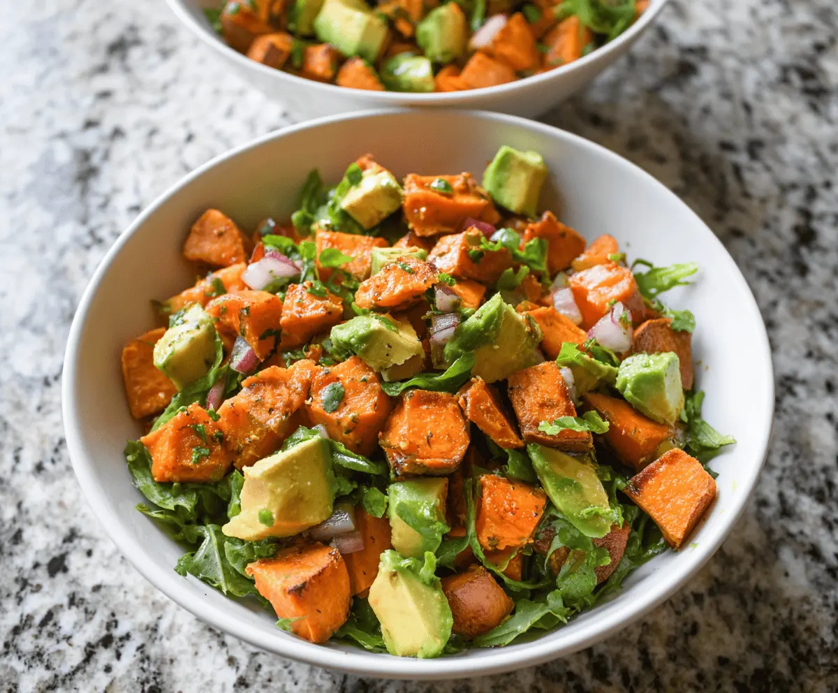 Delicious sweet potato salad with creamy avocado, served fresh and vibrant.