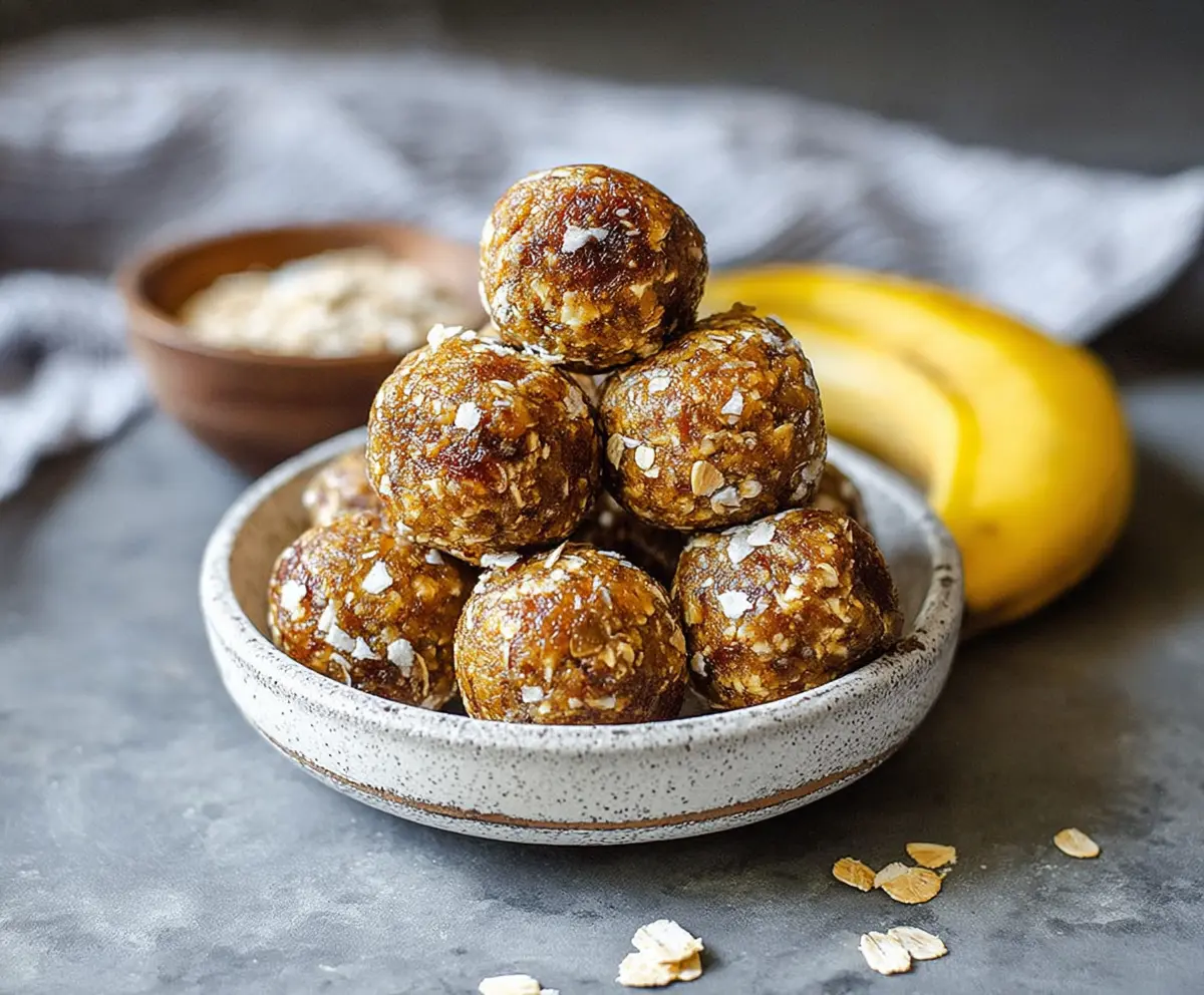 Healthy banana energy balls with oats and honey in a glass jar.
