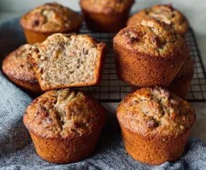 Delicious homemade sourdough banana muffins fresh out of the oven, golden and fluffy