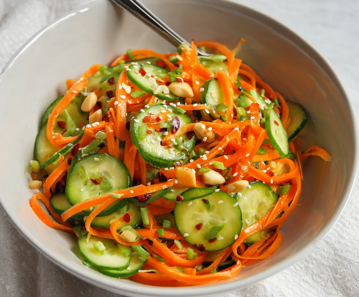 Vibrant Asian Carrot and Cucumber Salad with fresh herbs and sesame seeds