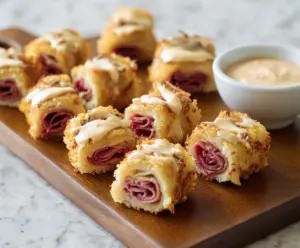 Delicious Mini Reuben Bites with corned beef, sauerkraut, and Swiss cheese on rye bread.