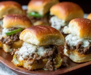 Delicious Philly Cheesesteak Sliders with Ground Beef and melted cheese on a serving platter.