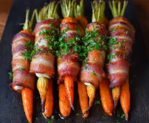 Delicious bacon-wrapped carrots roasted to perfection for a savory appetizer.