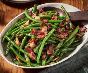 Delicious green beans cooked with crispy bacon, perfect for a flavorful side dish.